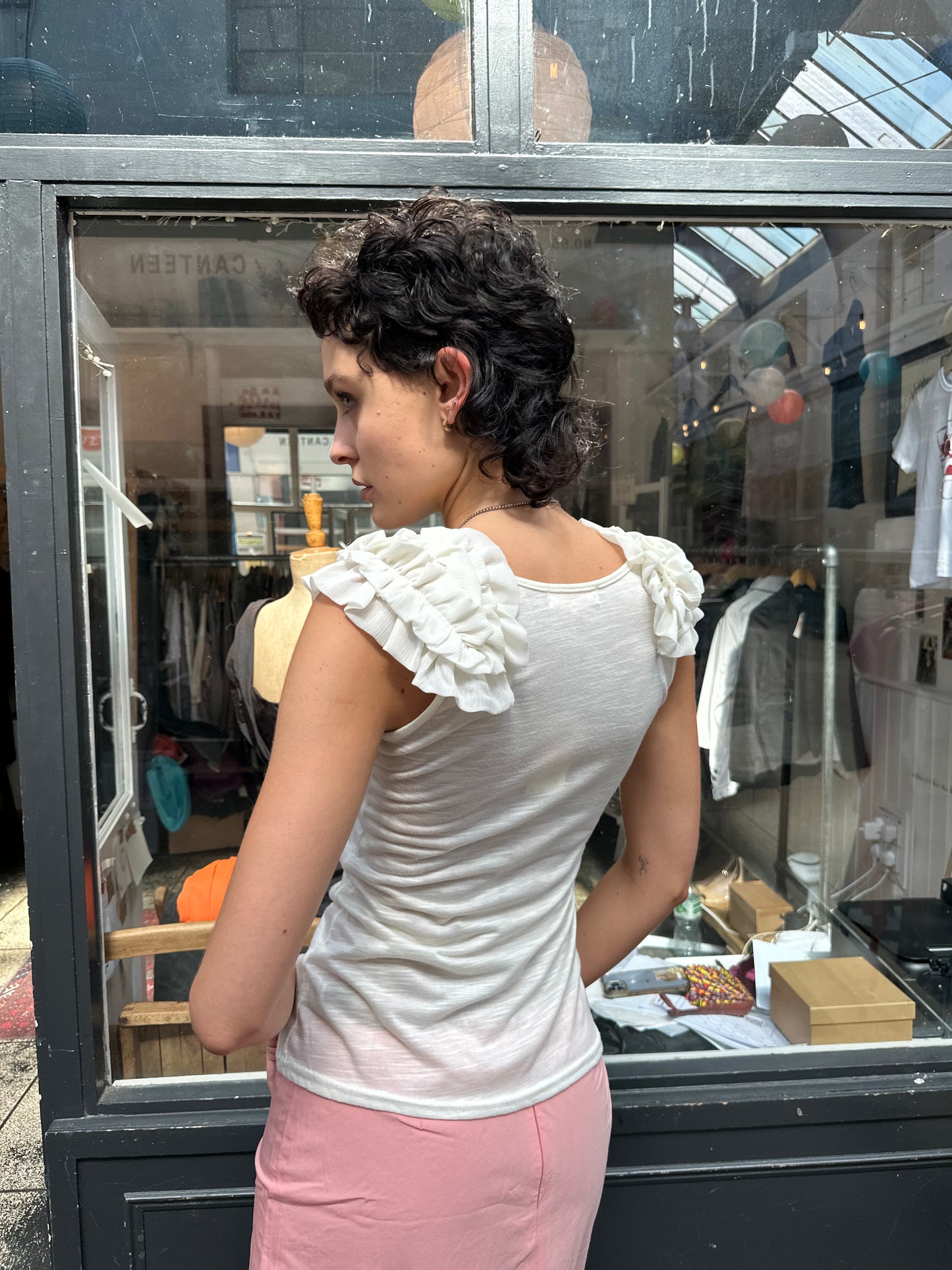 Cream tank with ruffled shoulders