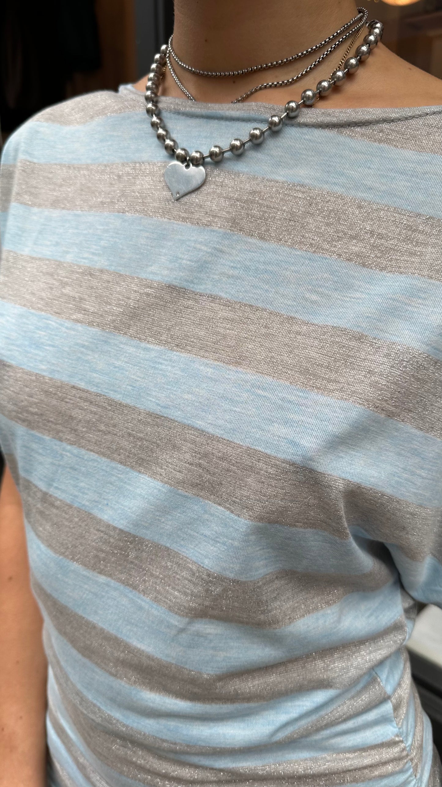 Blue and silver striped top