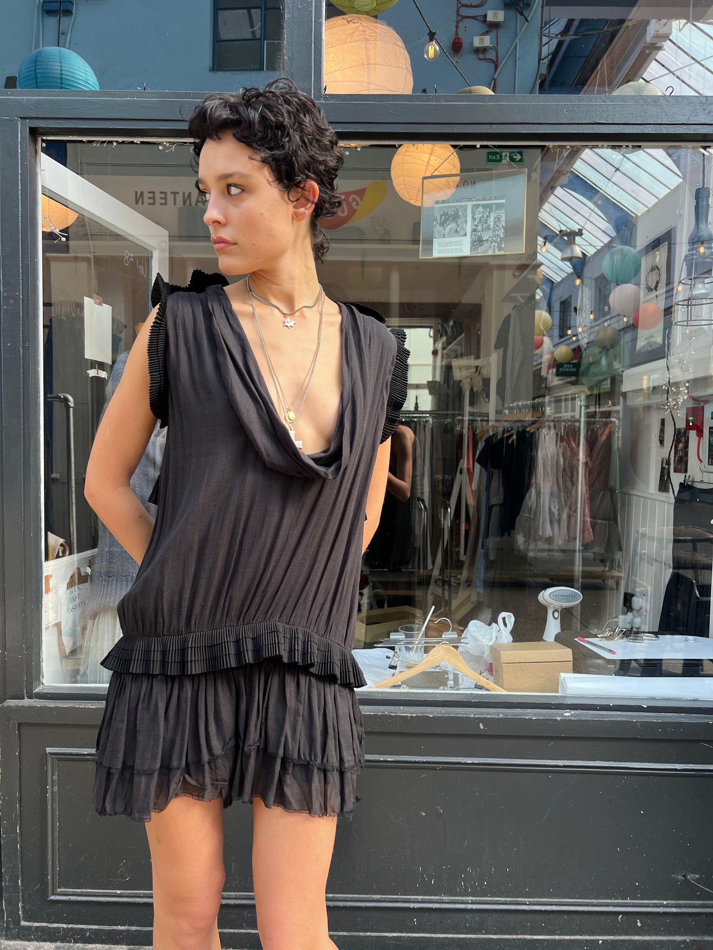 Black mini dress with pleated details