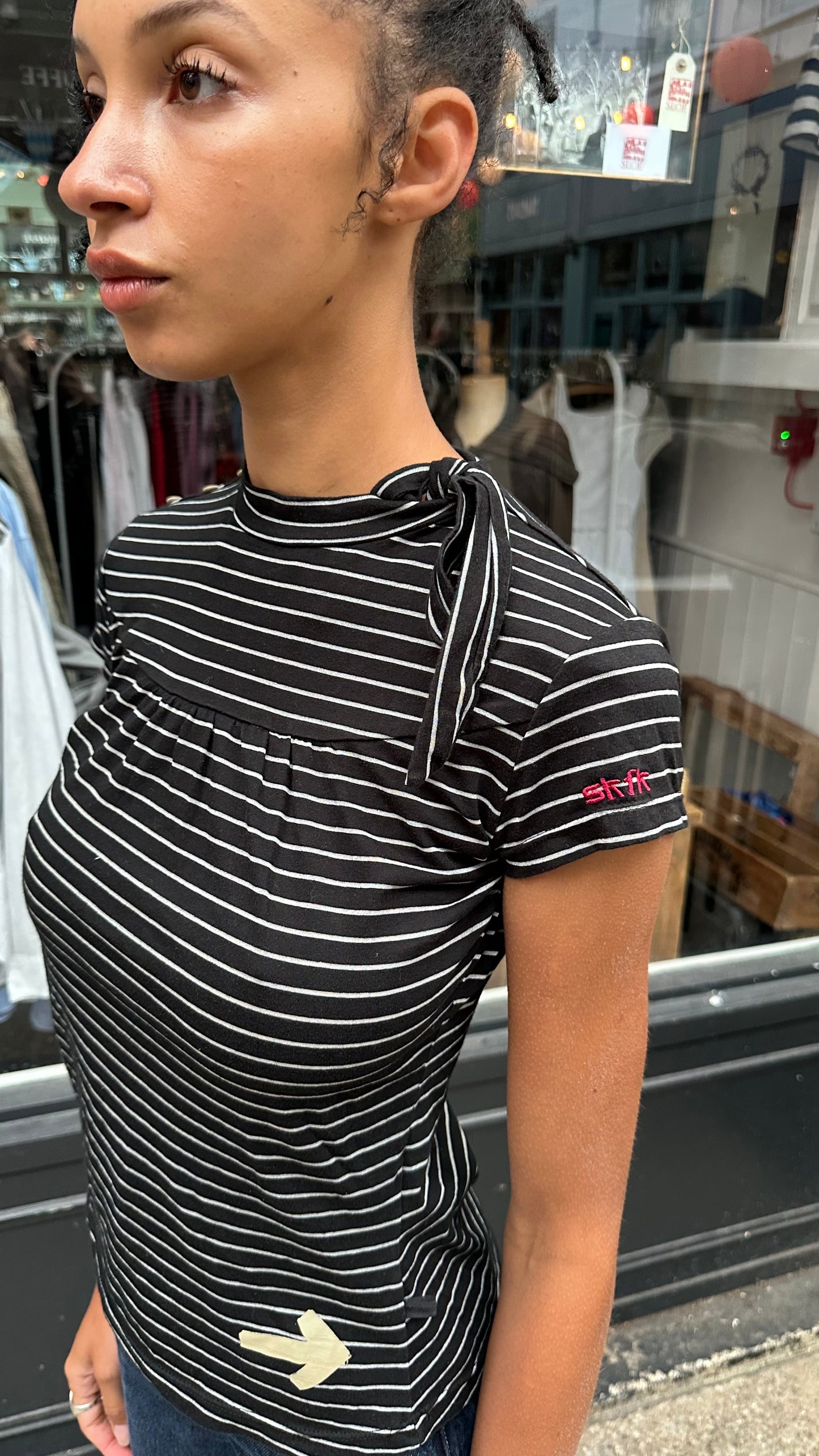 black and white striped top with high neck