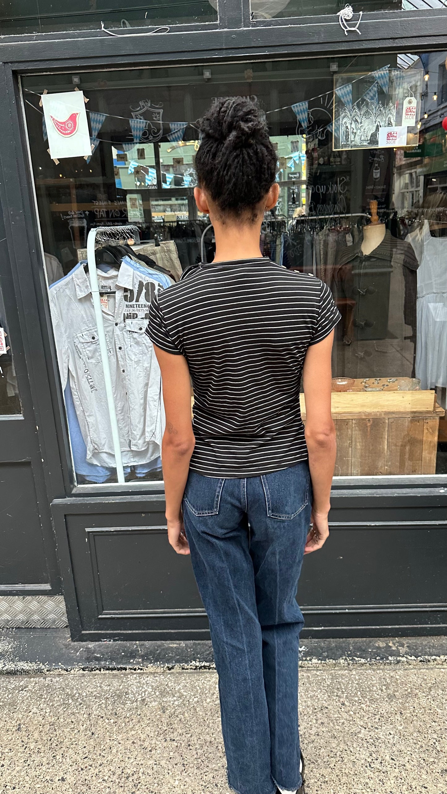 black and white striped top with high neck