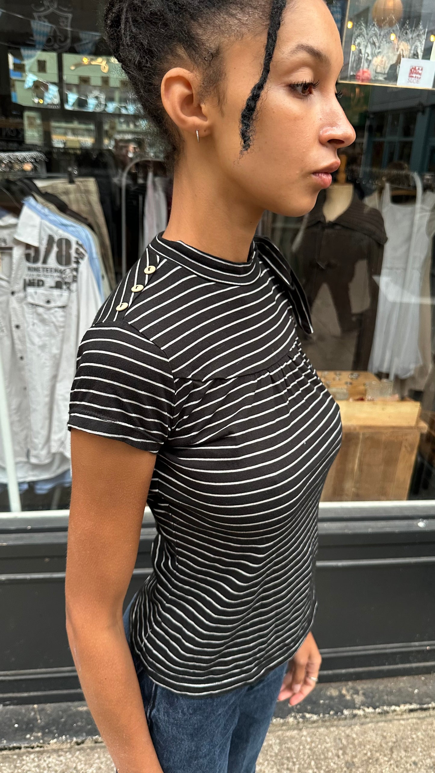 black and white striped top with high neck