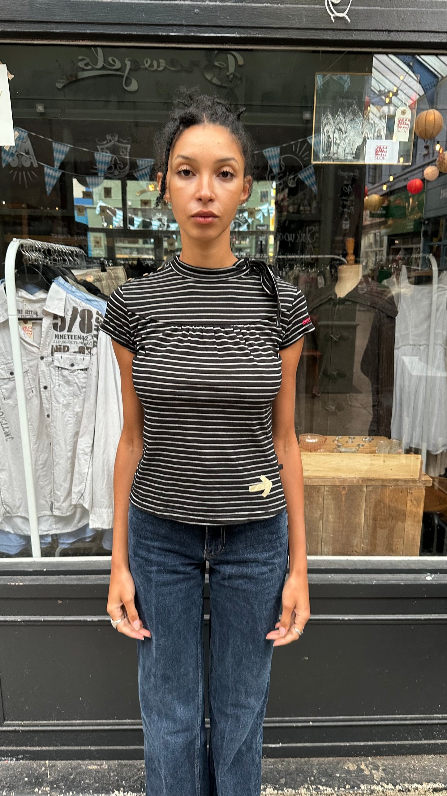 black and white striped top with high neck