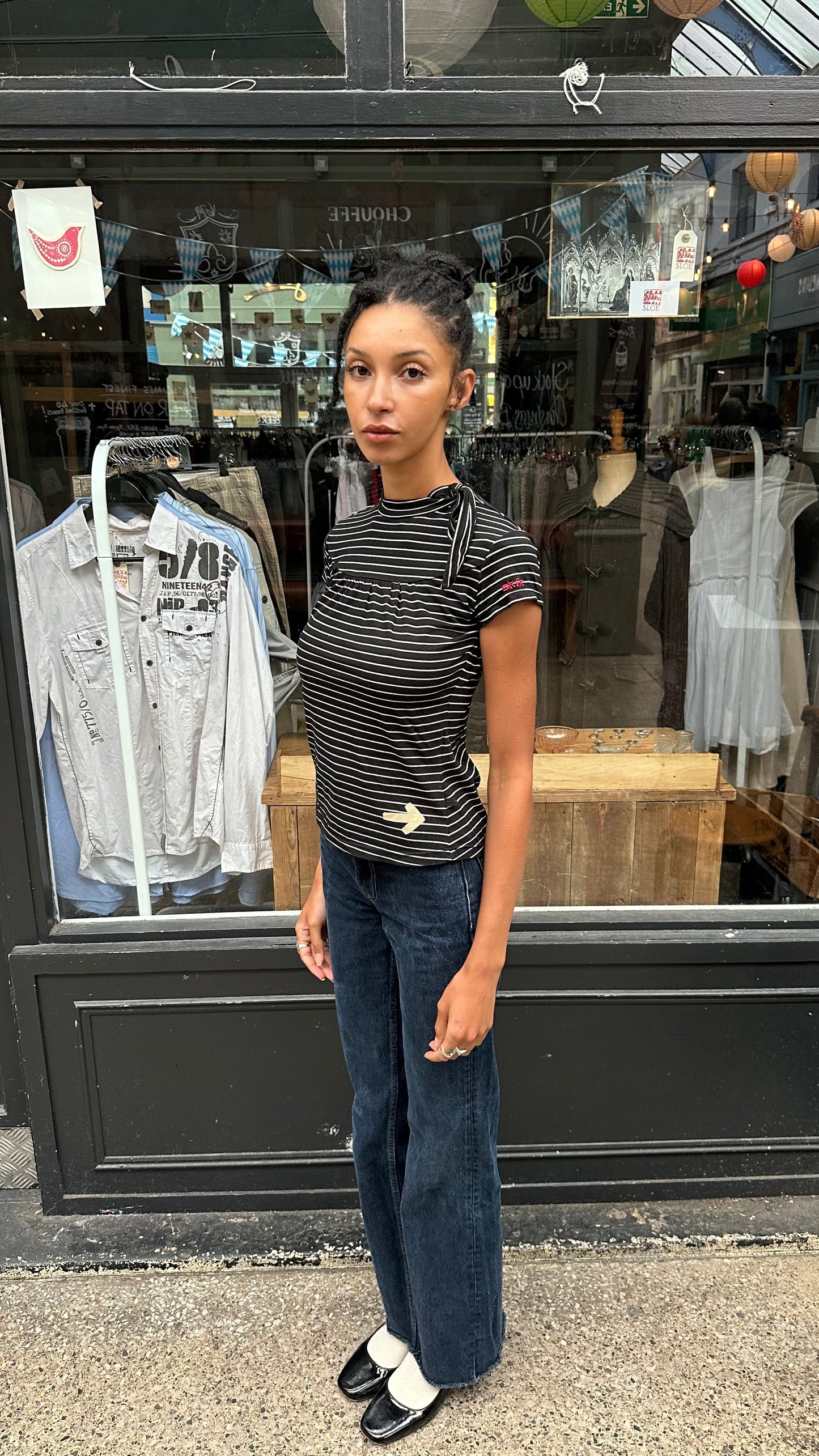 black and white striped top with high neck