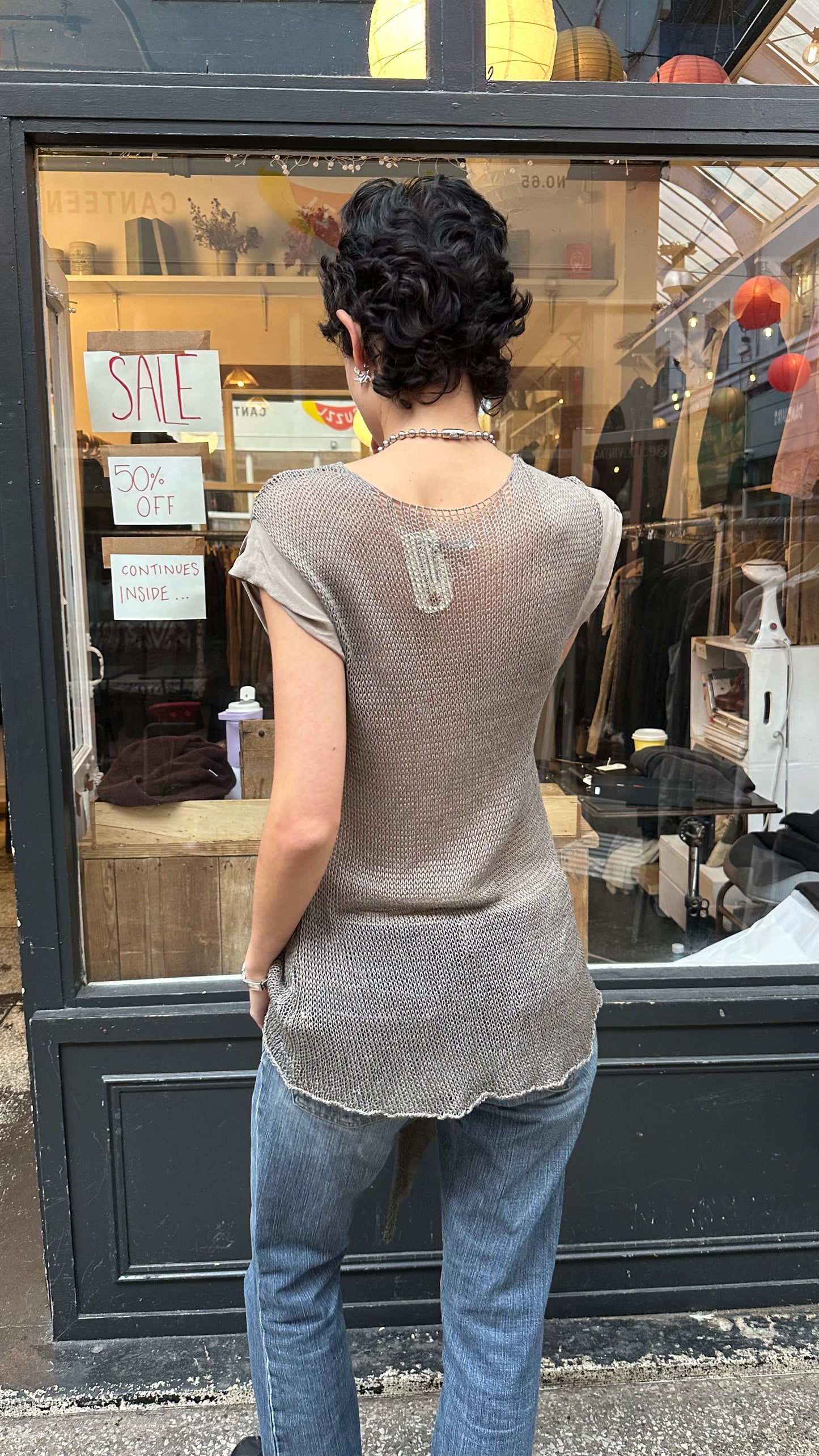 Grey crochet top labelled 40