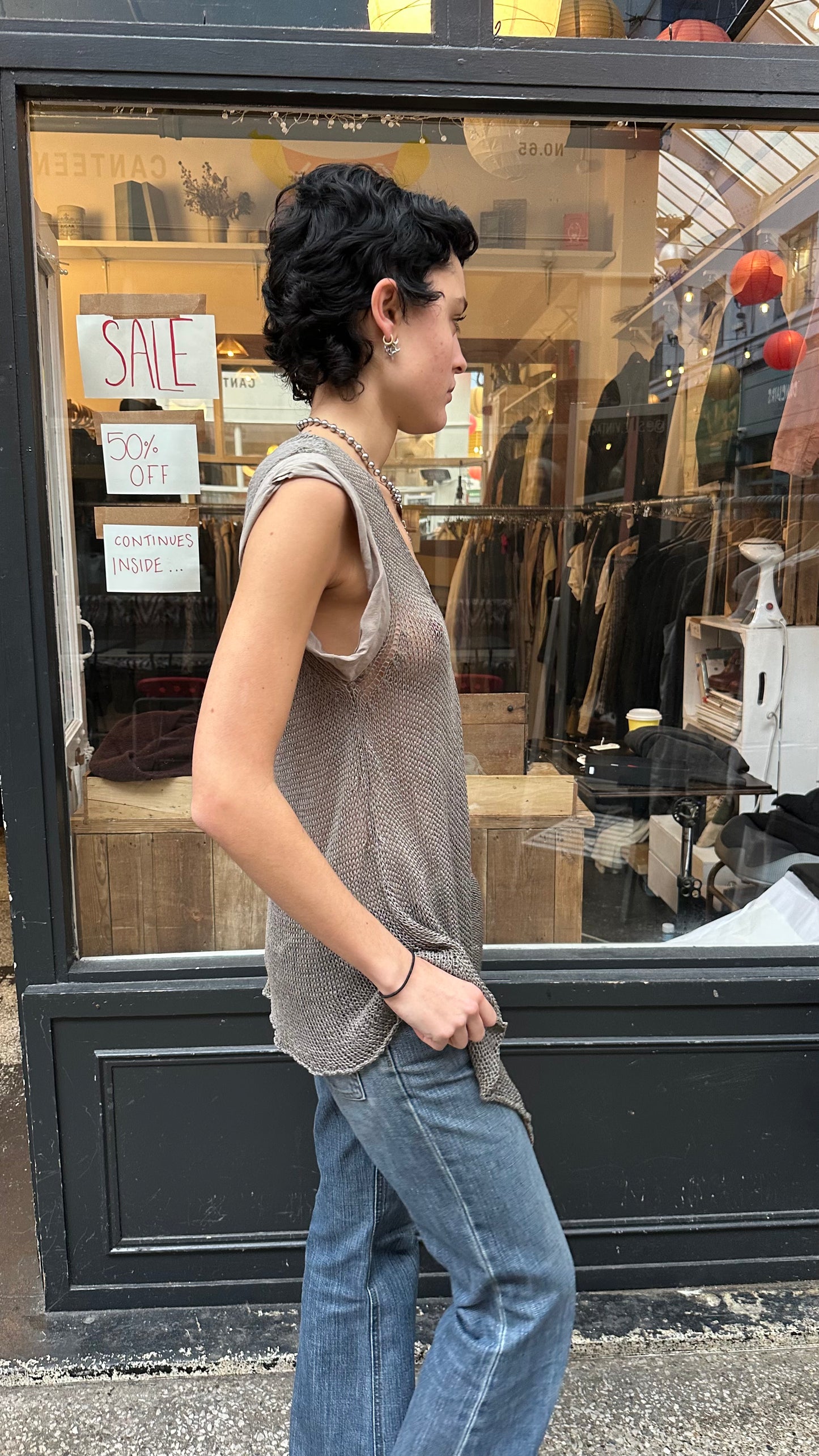 Grey crochet top labelled 40