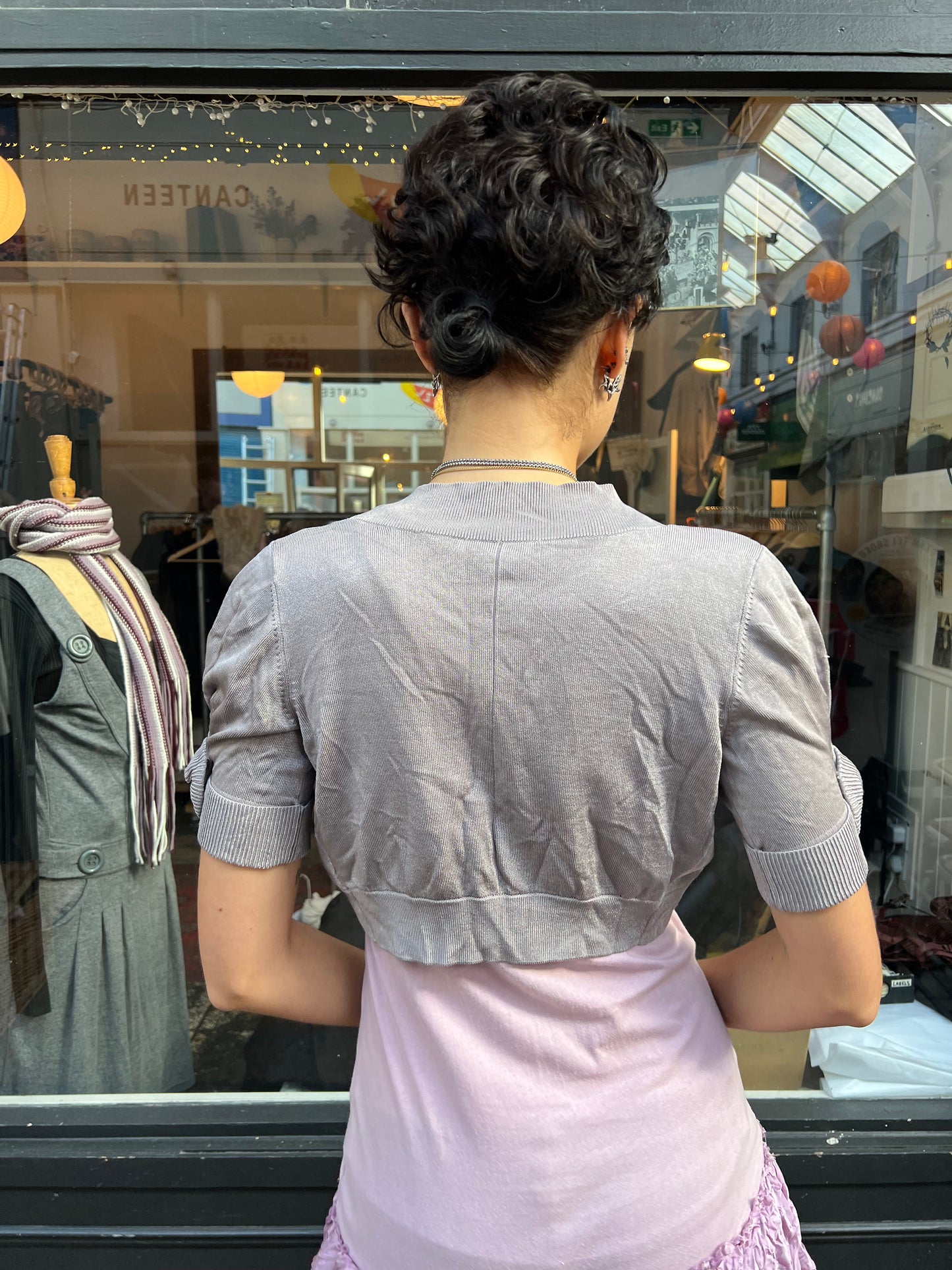Grey bolero with roses on the sleeves