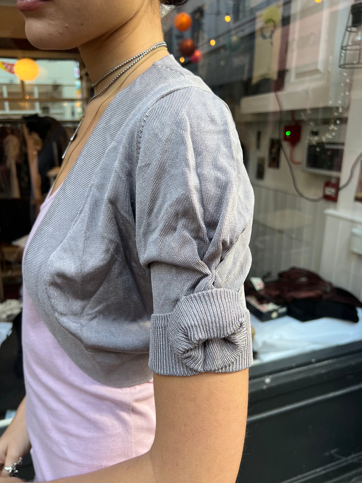 Grey bolero with roses on the sleeves