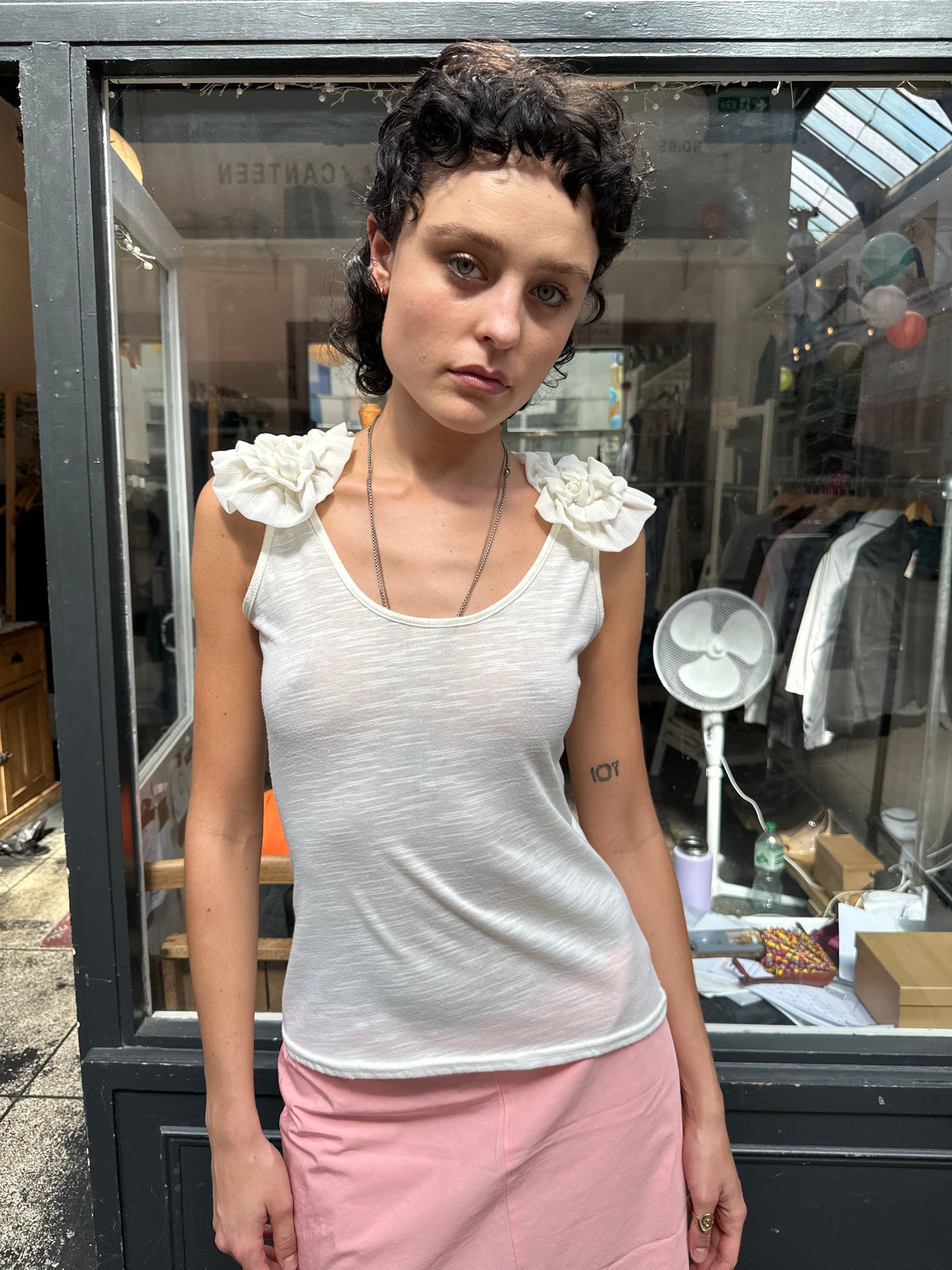 Cream tank with ruffled shoulders