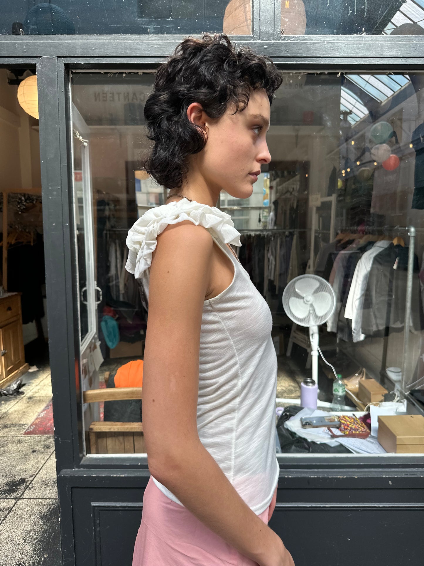 Cream tank with ruffled shoulders
