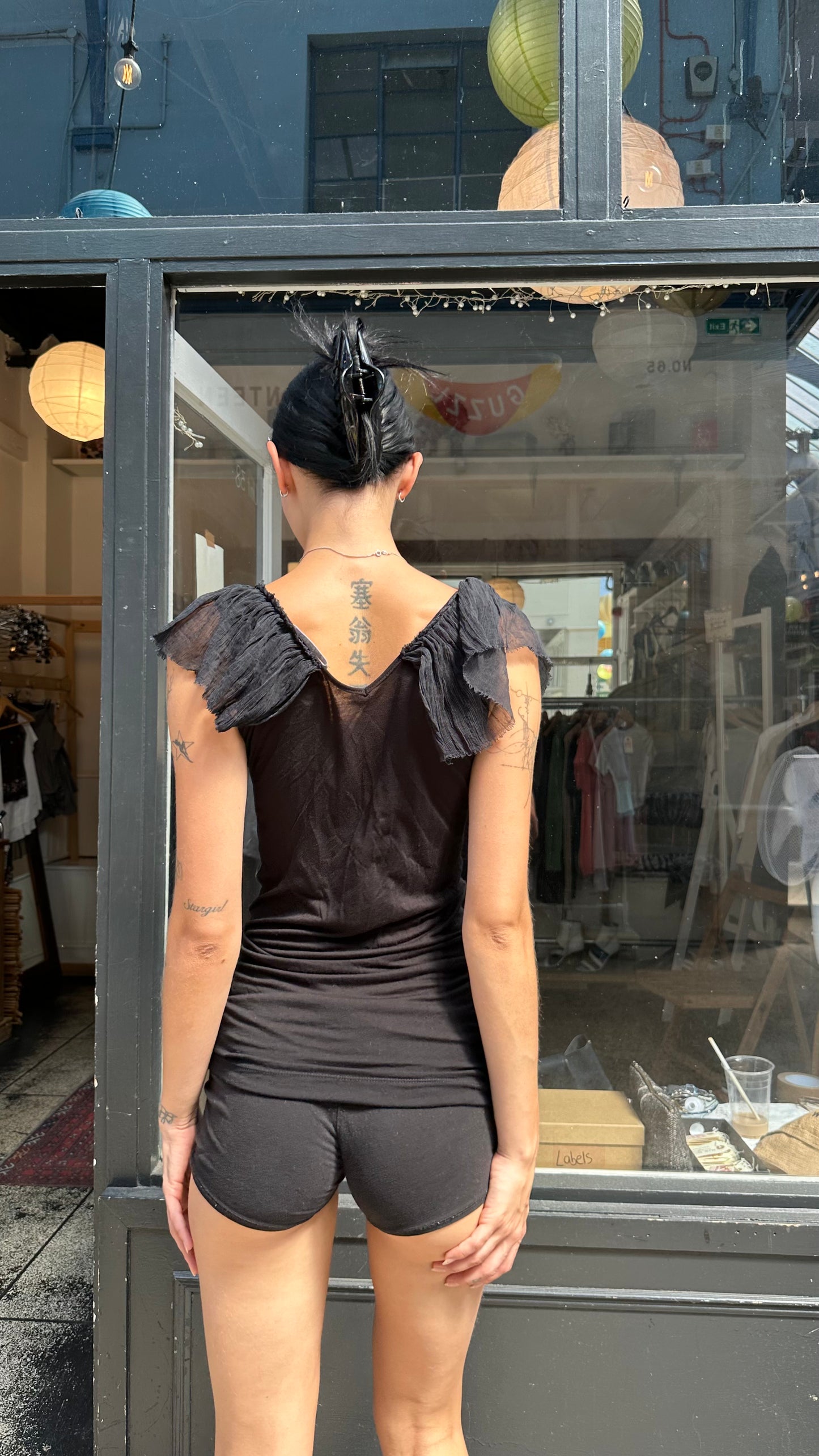Black top with ruffled sleeves
