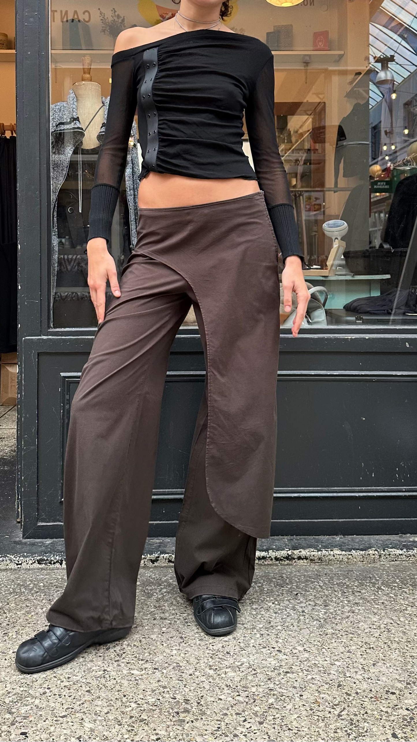 Brown trousers with asymmetric leg