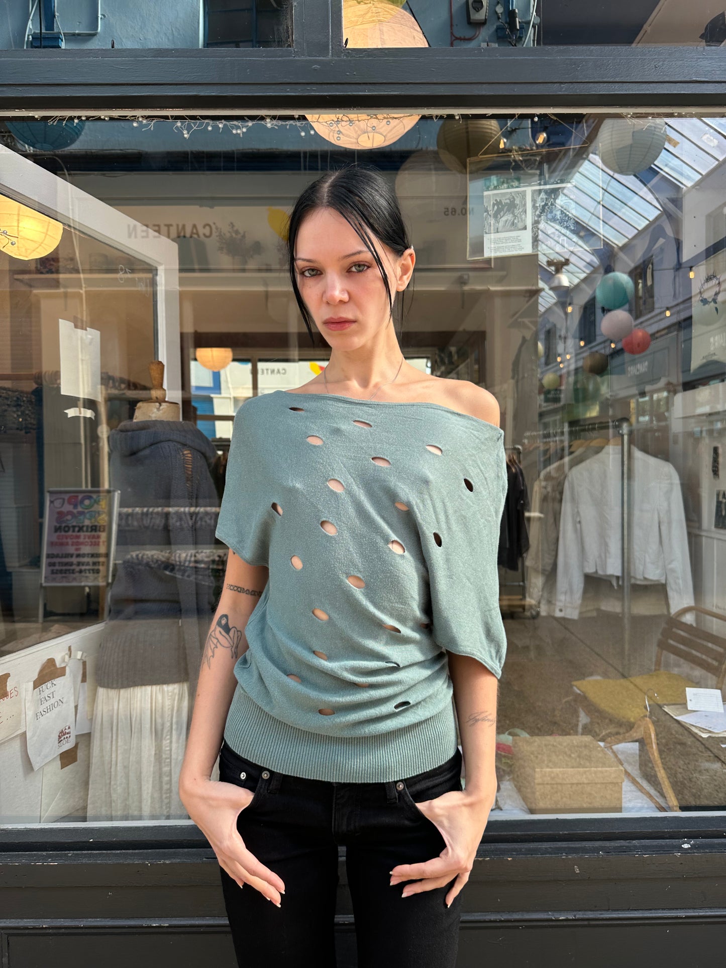 Green slouchy top with holes