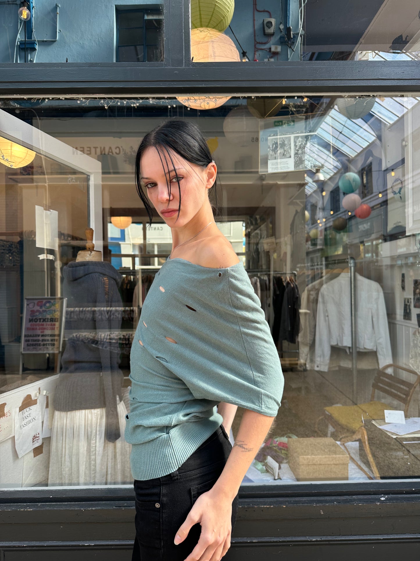 Green slouchy top with holes