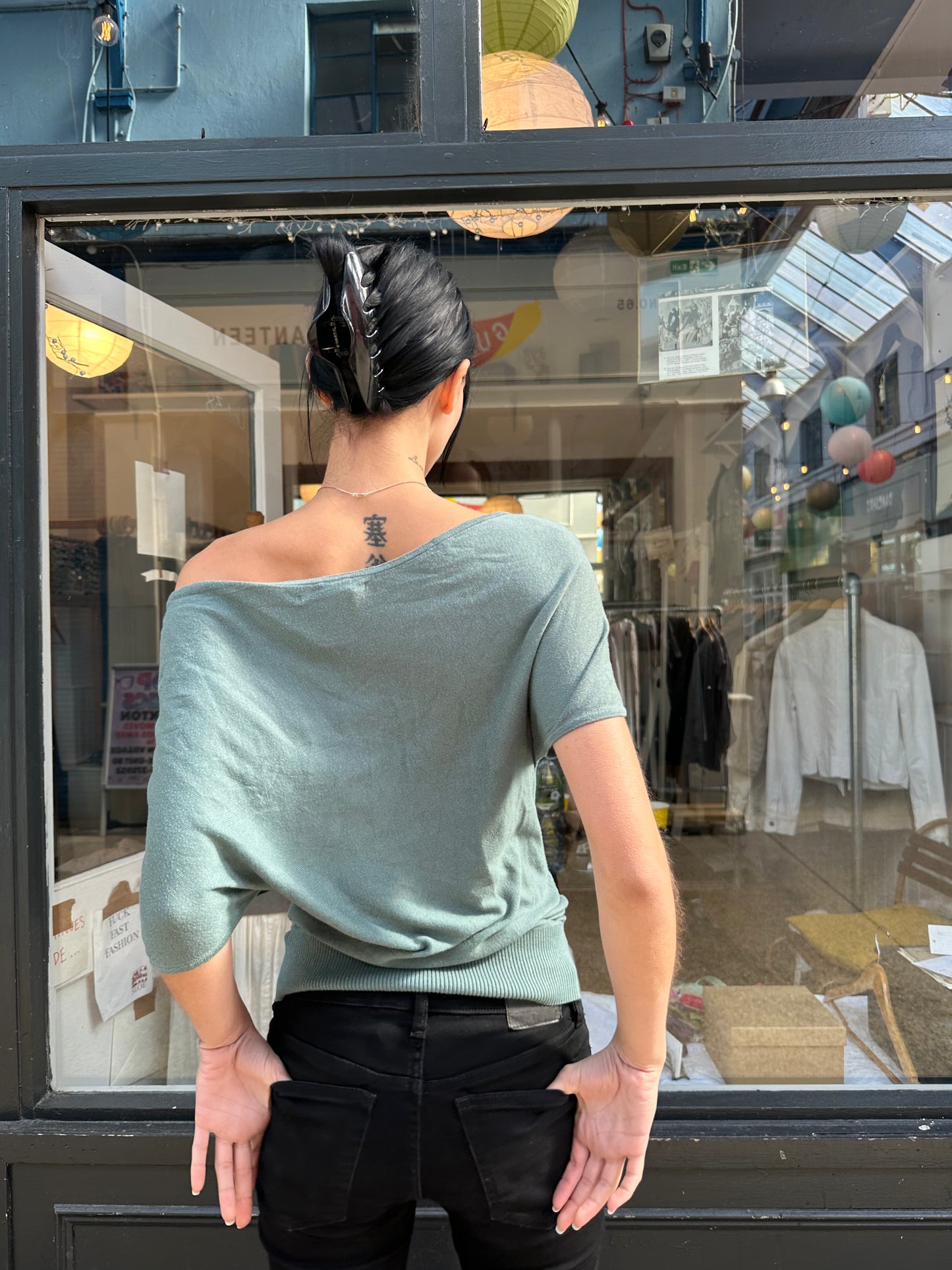 Green slouchy top with holes