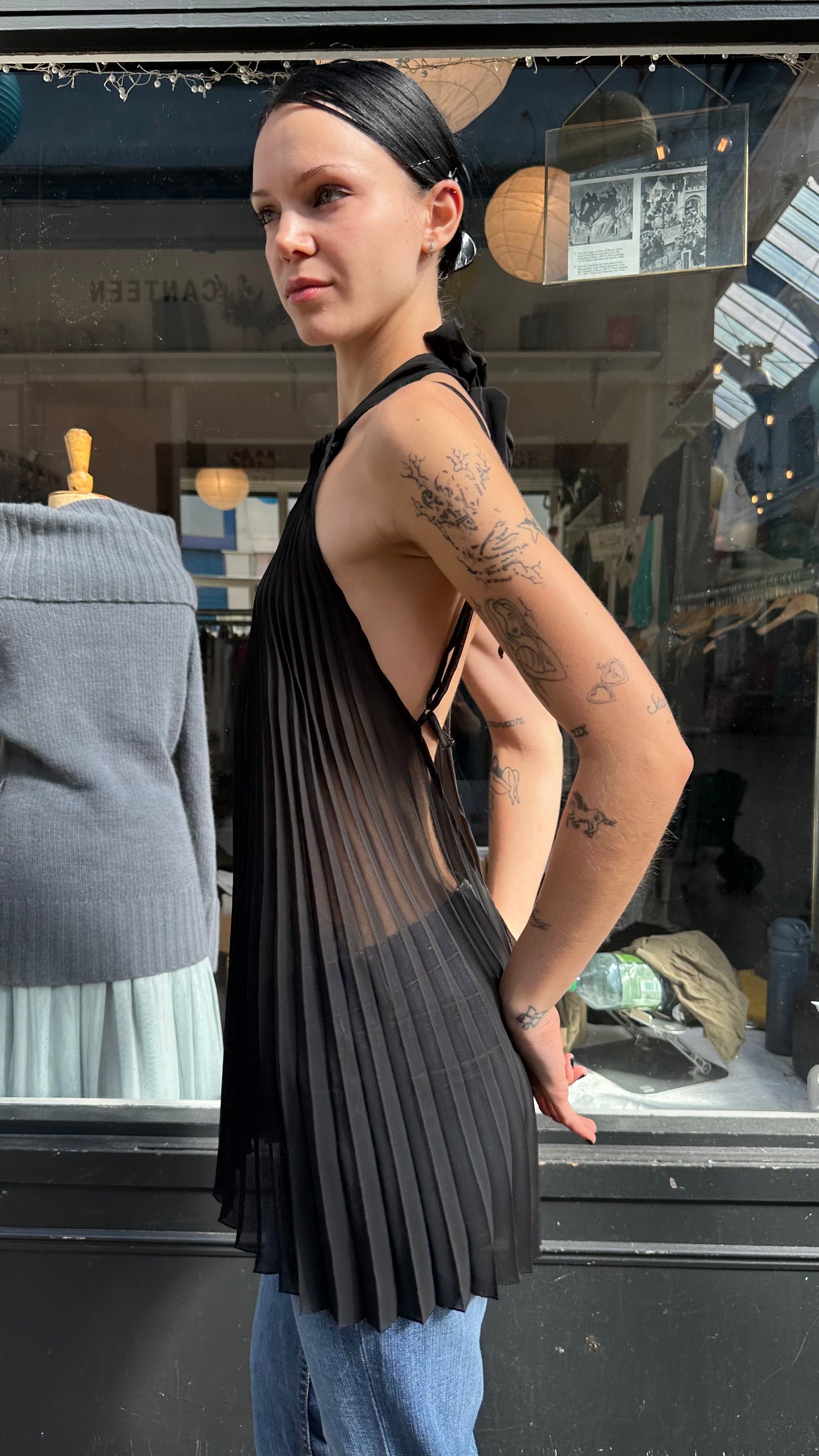 Black pleated sheer halter top with open back