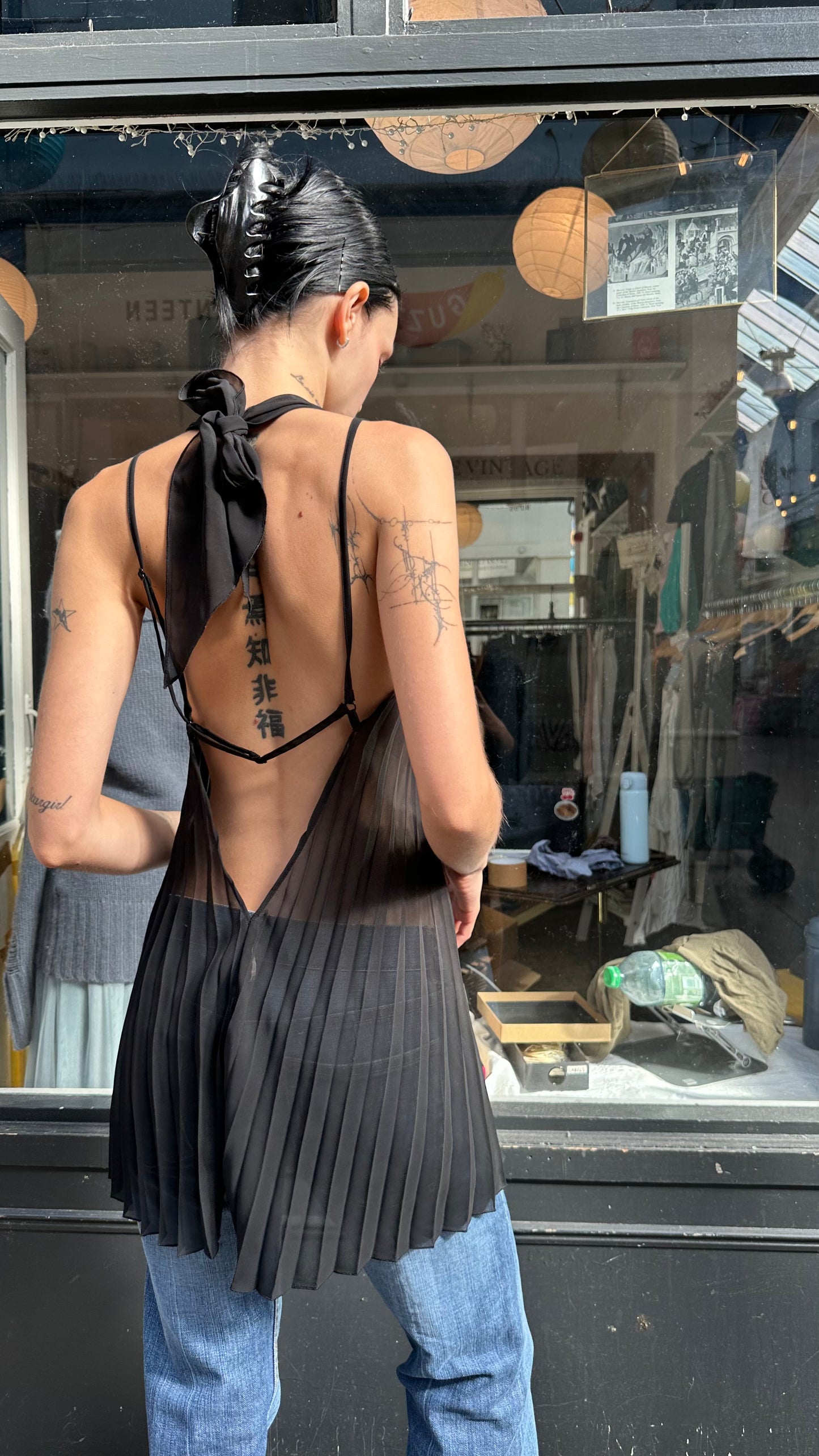 Black pleated sheer halter top with open back