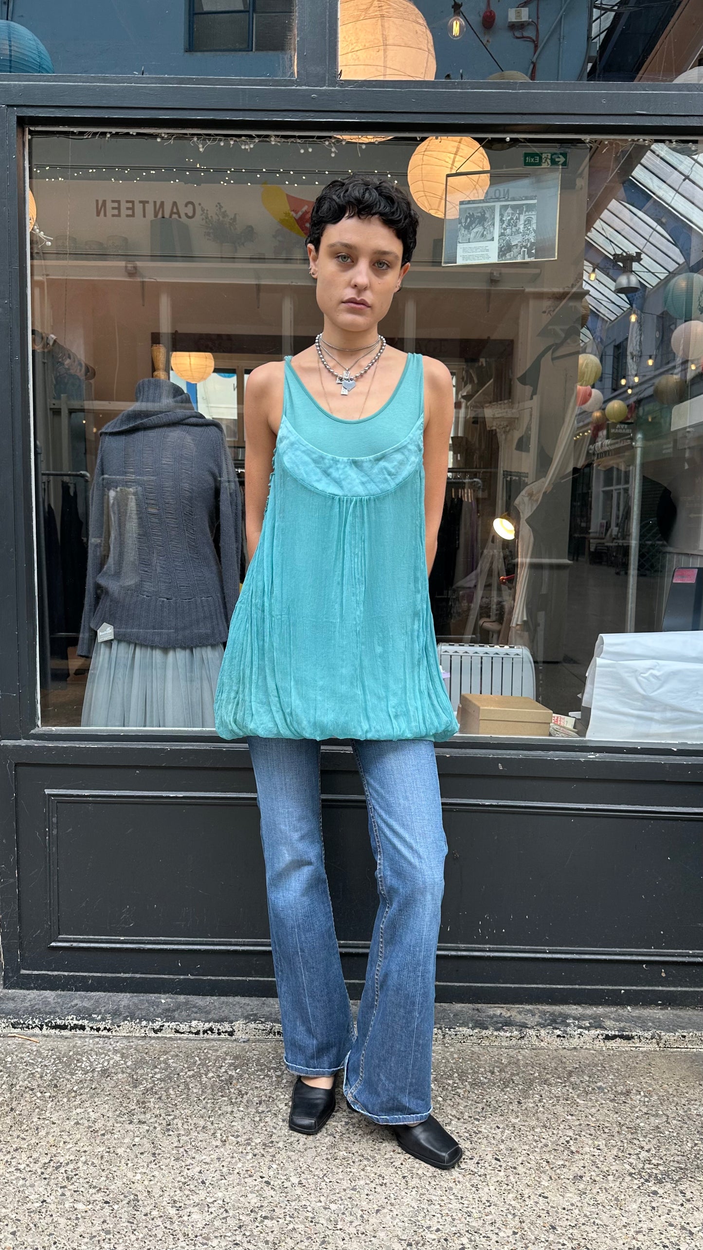 Turquoise bubble hem tank top with twisted straps