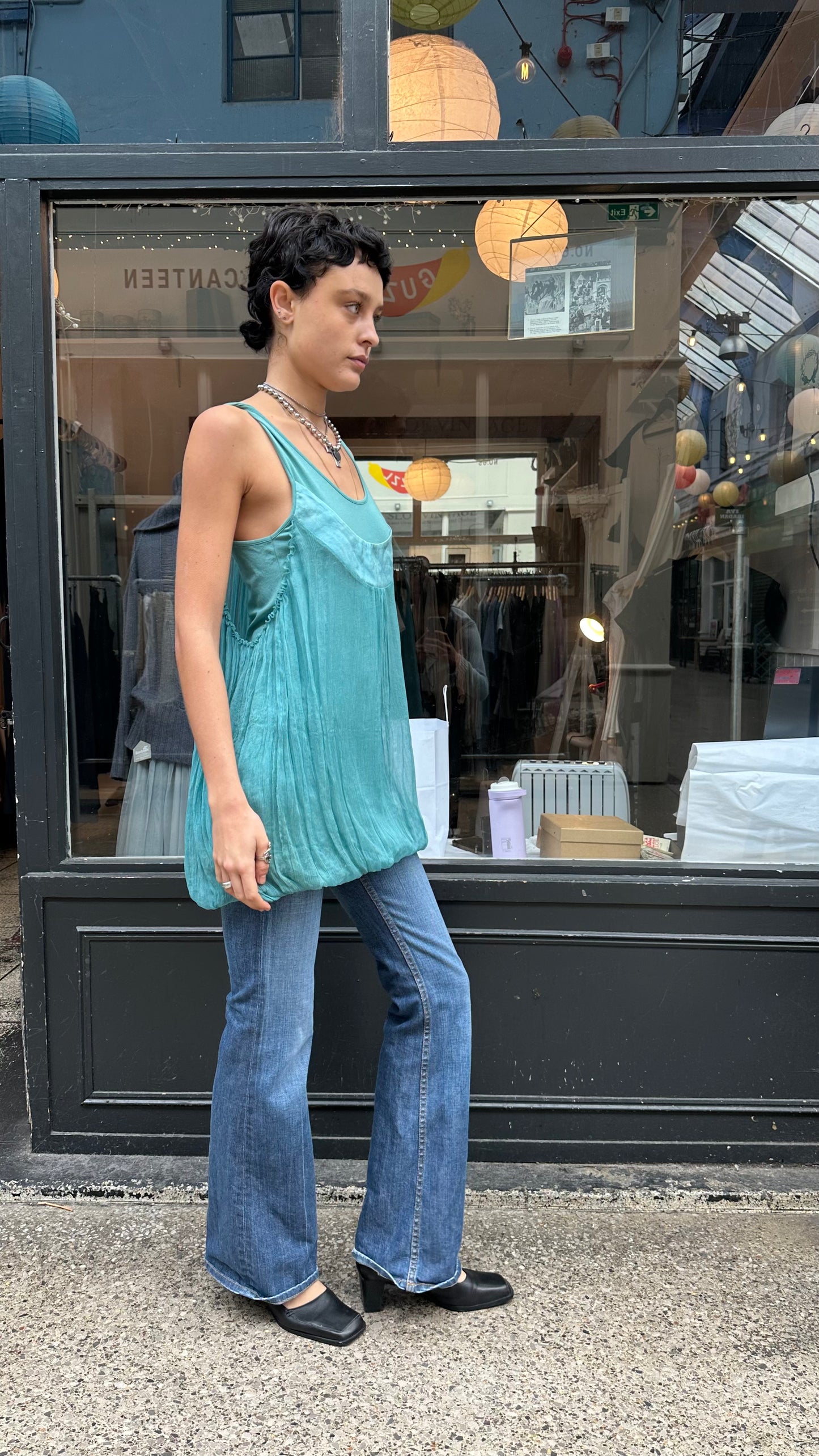 Turquoise bubble hem tank top with twisted straps