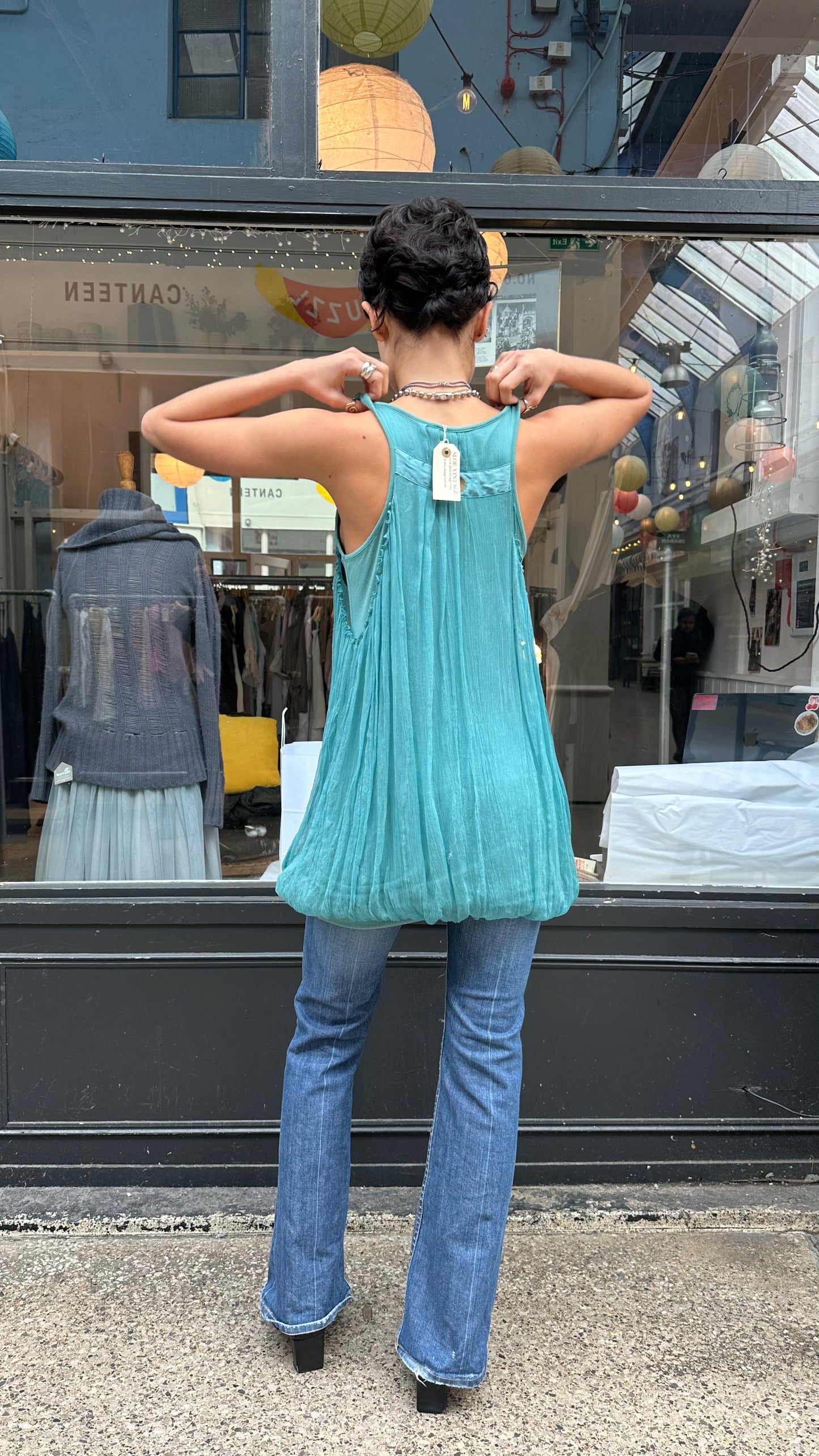 Turquoise bubble hem tank top with twisted straps