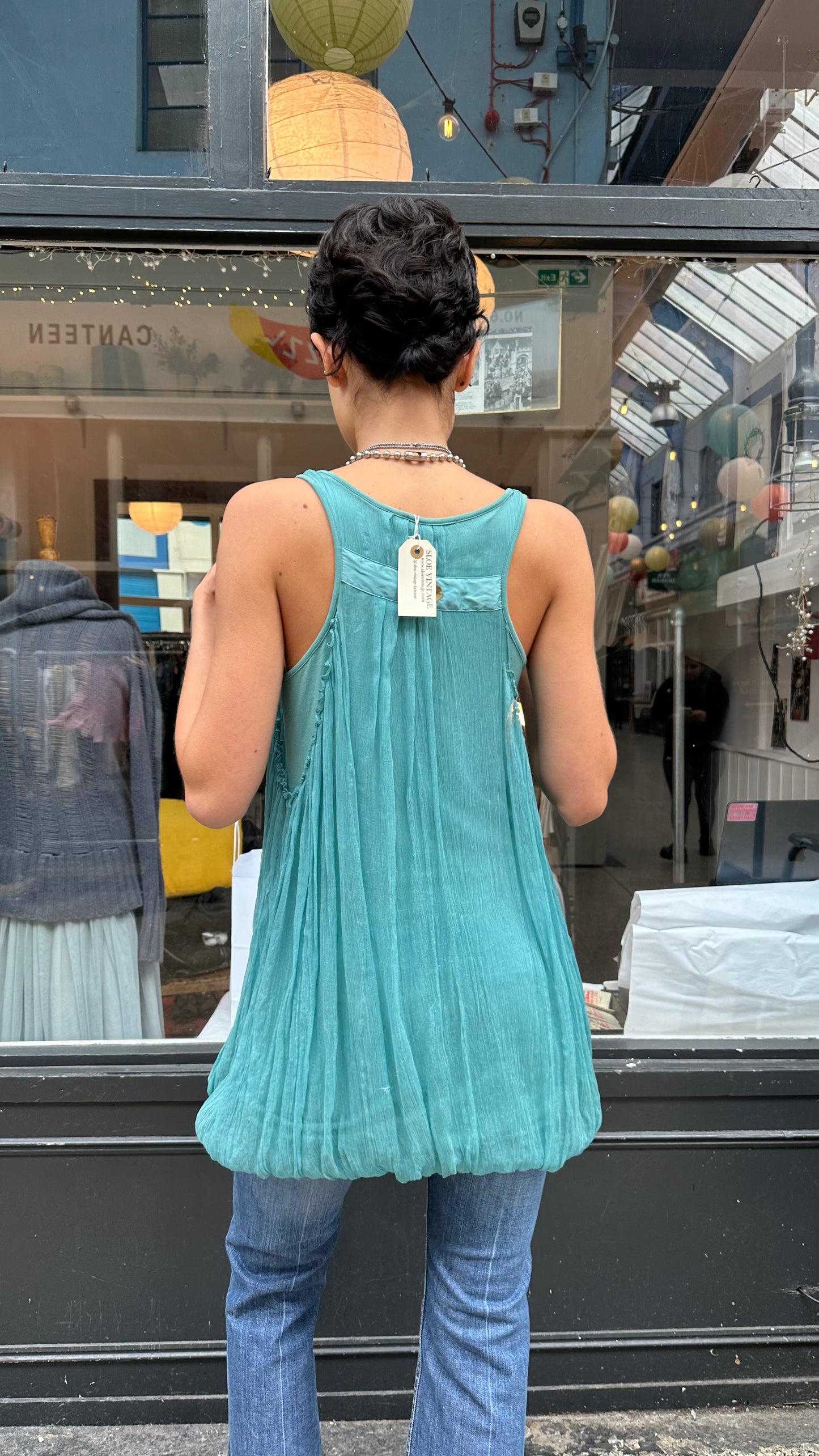 Turquoise bubble hem tank top with twisted straps