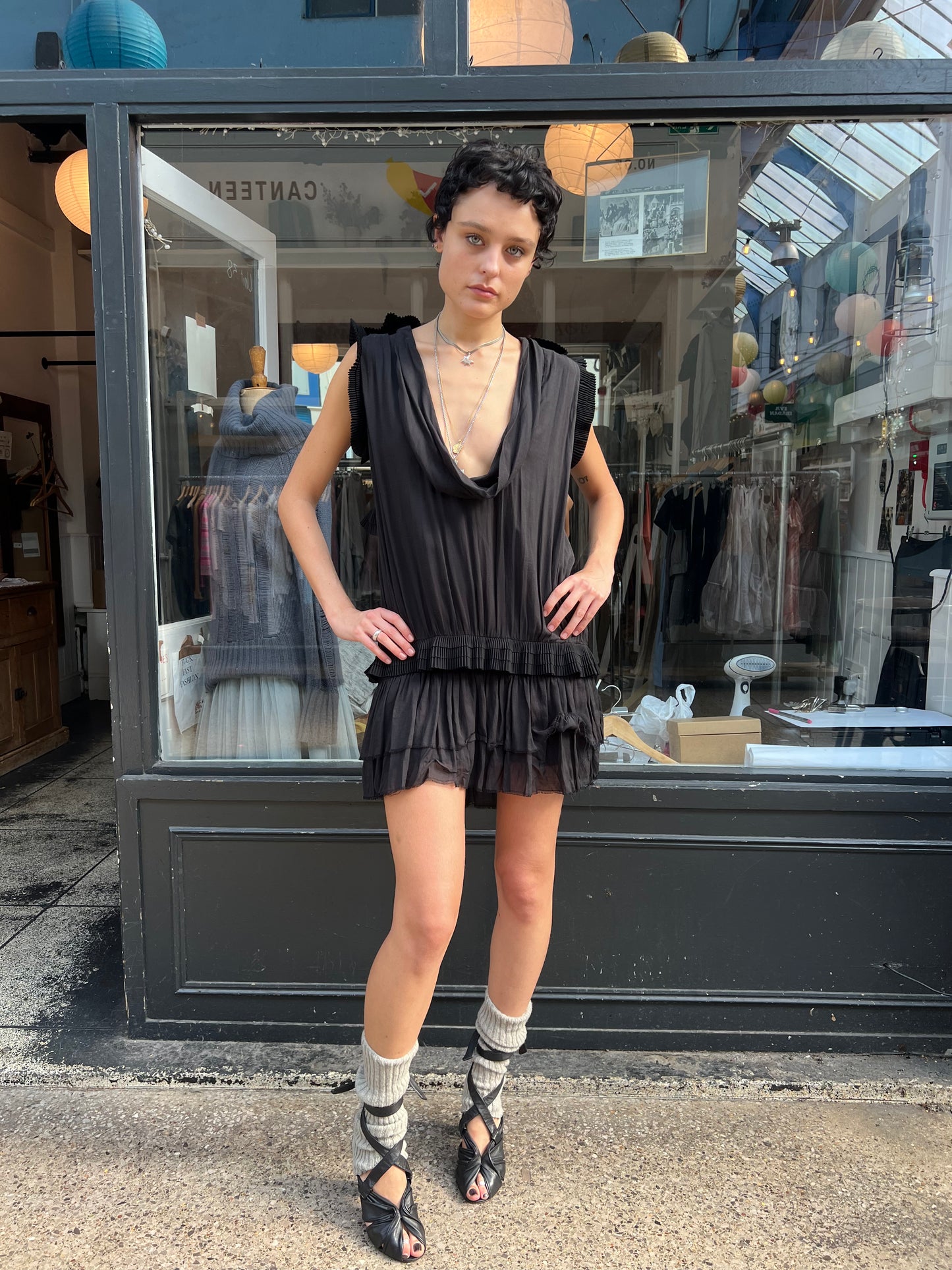 Black mini dress with pleated details
