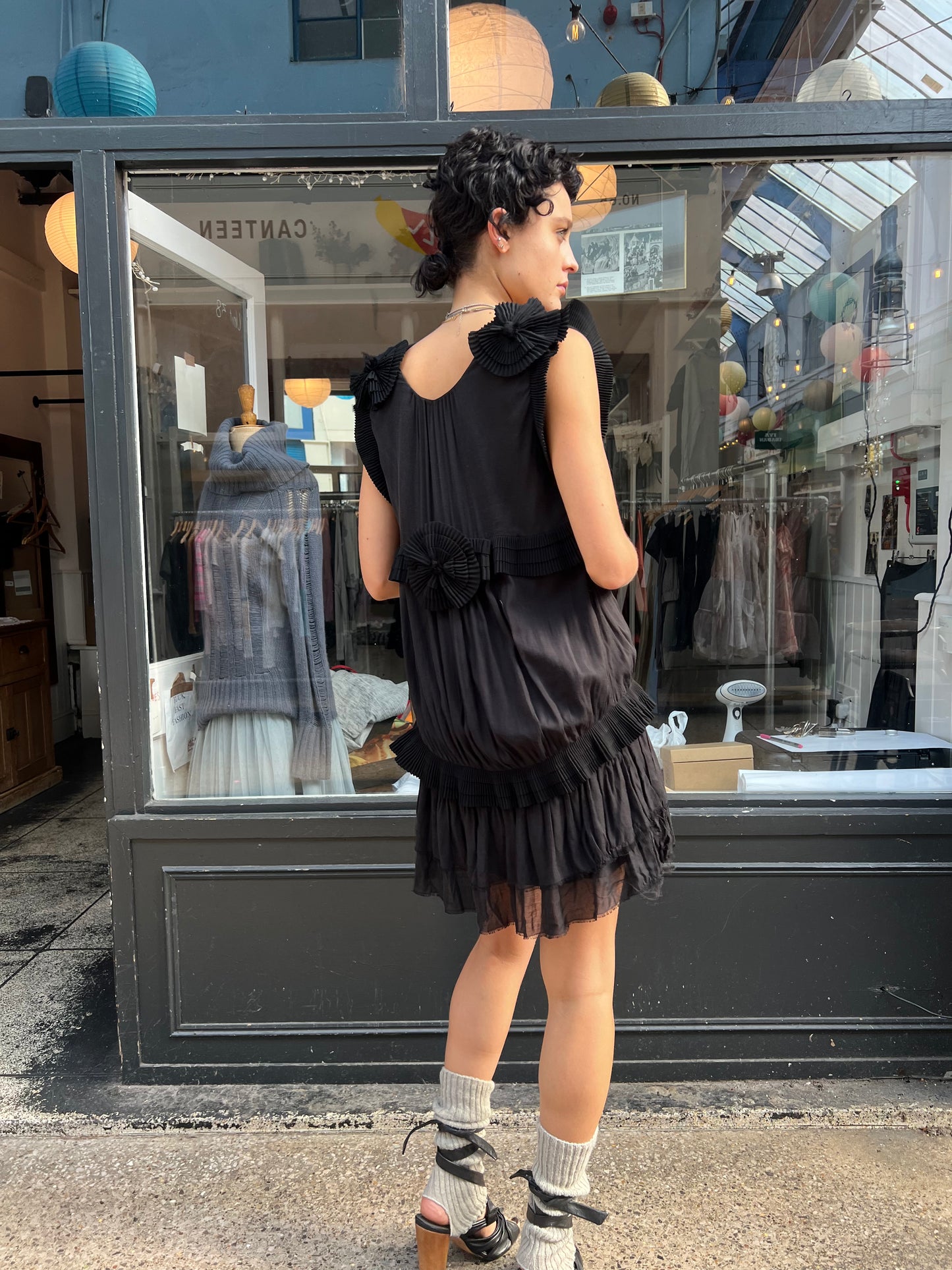 Black mini dress with pleated details