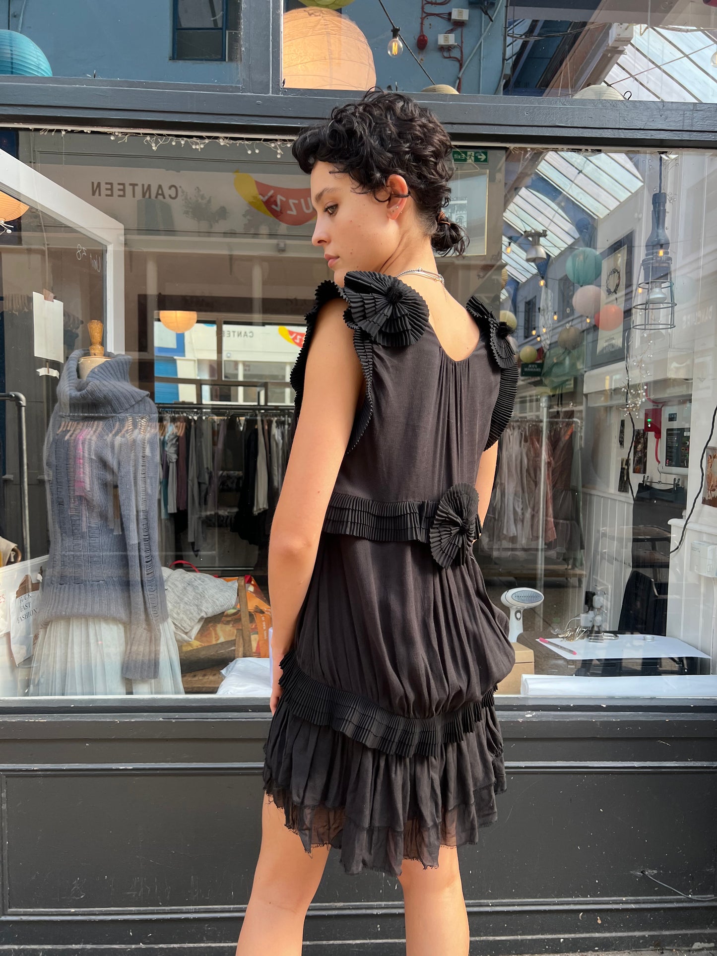Black mini dress with pleated details