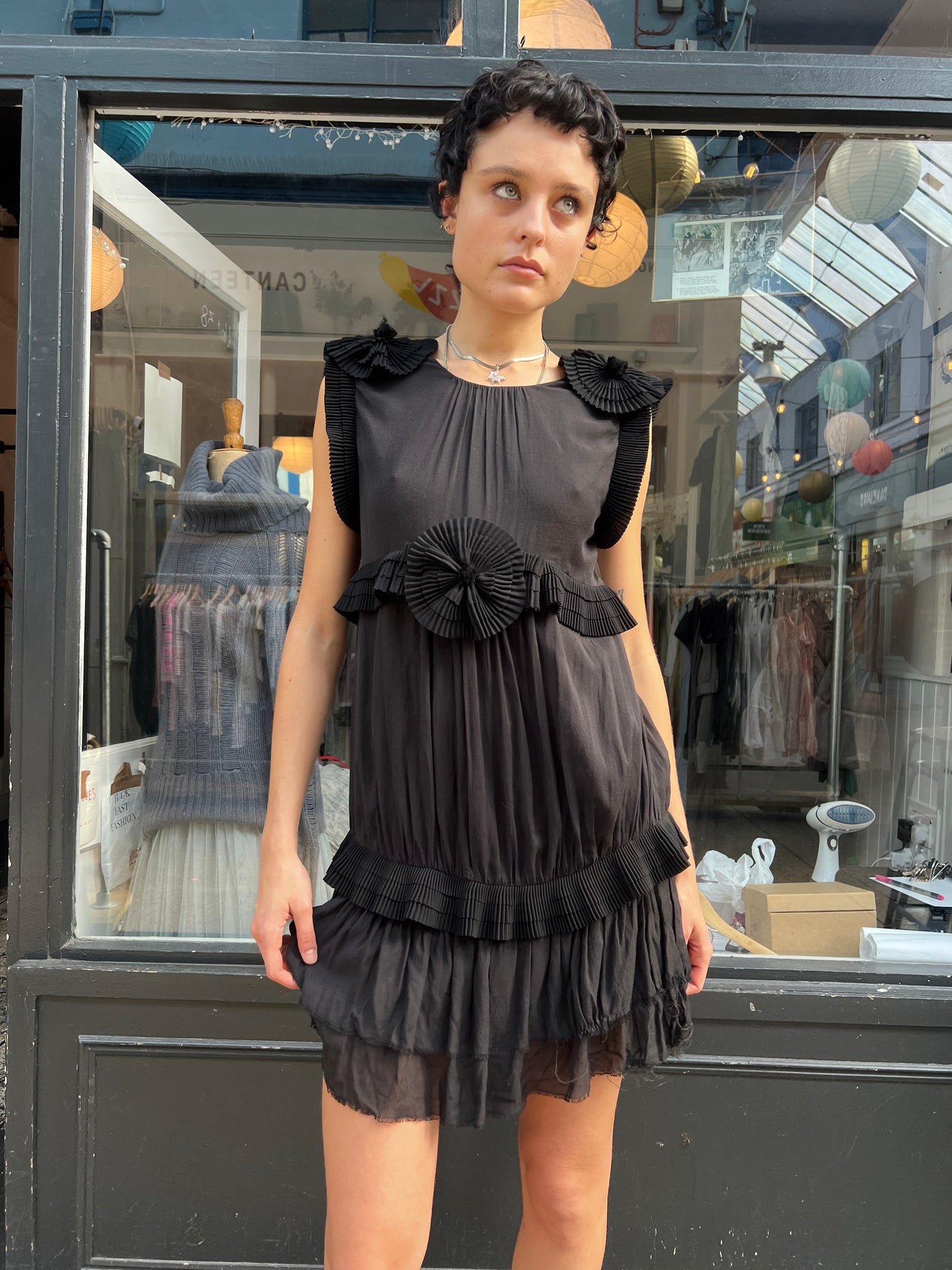 Black mini dress with pleated details