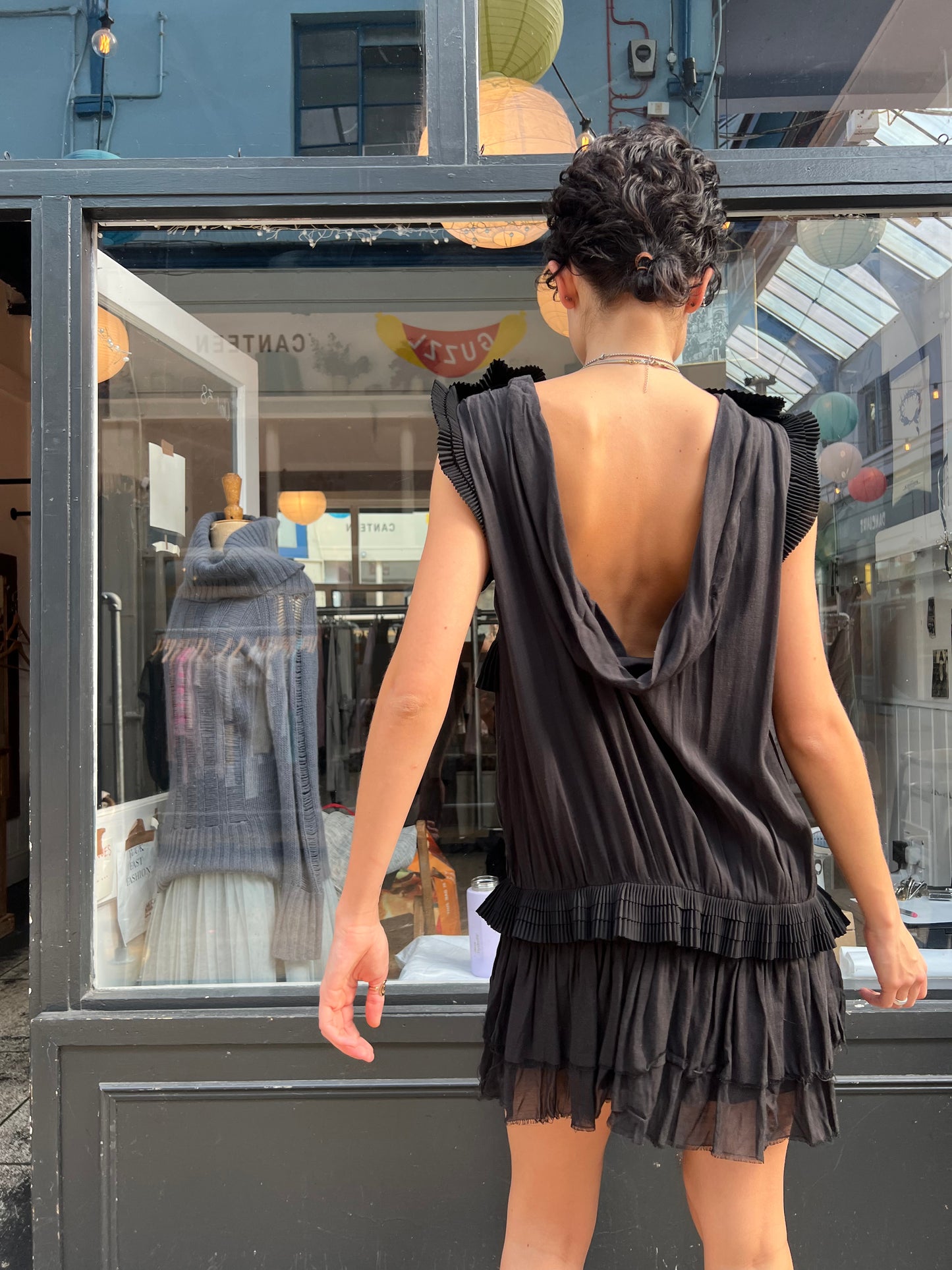 Black mini dress with pleated details